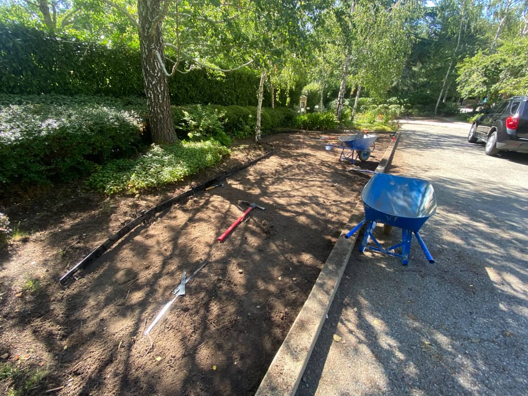 Irrigation line run out across a prepared bed before planting begins